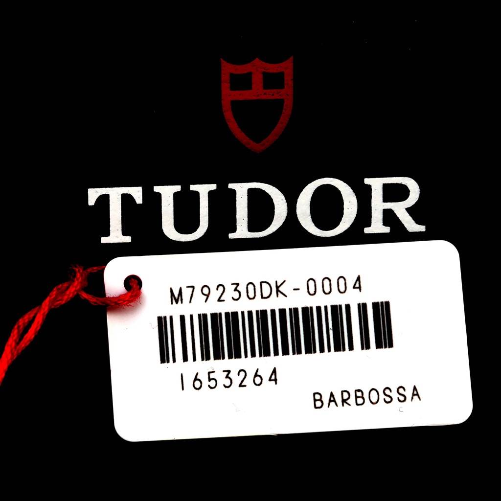 The image shows the tag for a Tudor Heritage Black Bay 79230DK Men's Stainless Steel Black Dial 79230DK Men's Stainless Steel Black Dial watch, displaying the model number M79230DK-0004.
