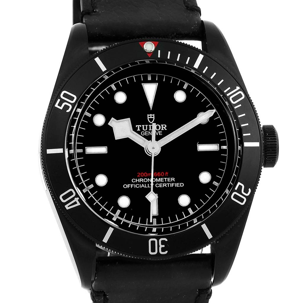 The image shows a front view of the Tudor Heritage Black Bay 79230DK Men's Stainless Steel Black Dial 79230DK Men's Stainless Steel Black Dial watch, highlighting its black dial, bezel, and leather strap.