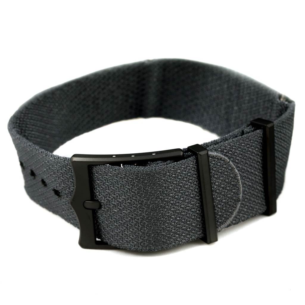 This image shows a close-up of the grey fabric watch strap for the Tudor Heritage Black Bay 79230DK Men's Stainless Steel Black Dial 79230DK Men's Stainless Steel Black Dial model.
