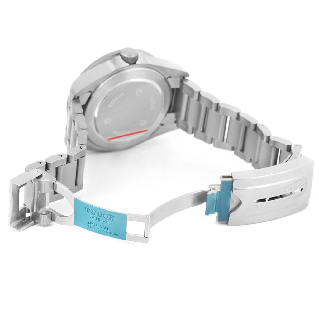 The image shows the Tudor Pelagos 25500TN Men
s Titanium Black Dial 25500TN Men
s Titanium Black Dial watch from a rear angle, featuring the case back, bracelet, and clasp.