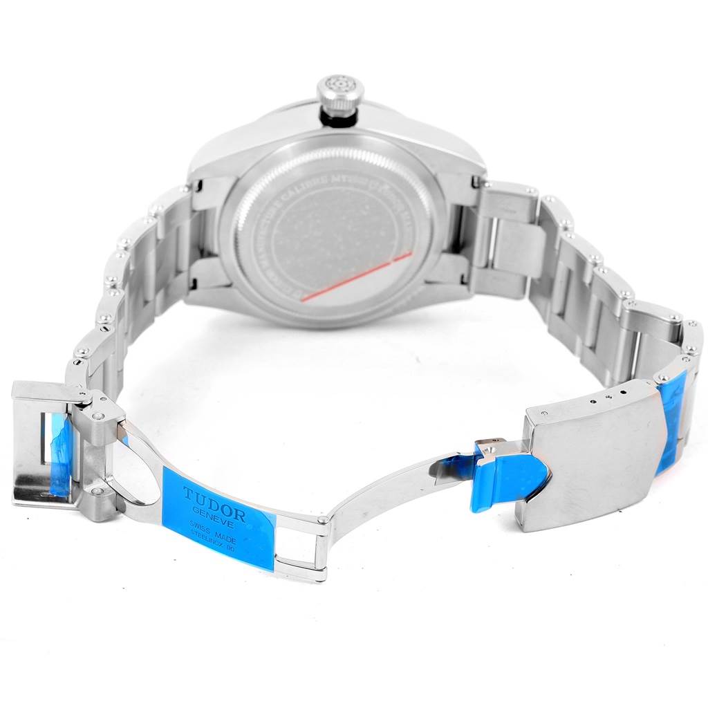 The image shows the Tudor Heritage Black Bay 79230N Men's Stainless Steel Black Dial 79230N Men's Stainless Steel Black Dial watch from the back, focusing on its opened stainless steel clasp and bracelet.