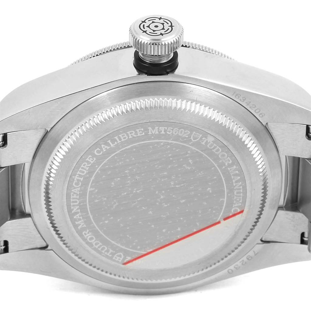 The image shows the back case and crown of the Tudor Heritage Black Bay 79230N Men's Stainless Steel Black Dial 79230N Men's Stainless Steel Black Dial watch, emphasizing the engraved details and crown logo.