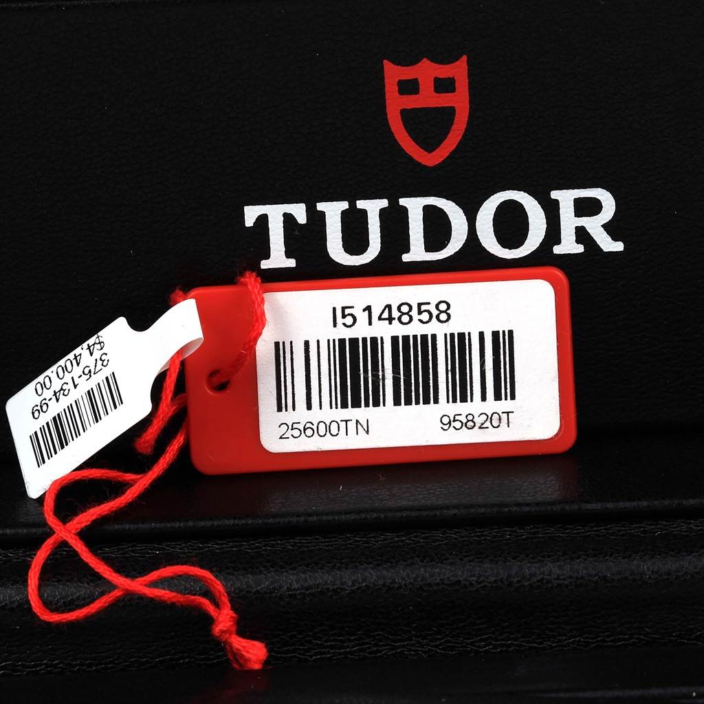 The image shows the barcode tag of a Tudor Pelagos 25600TN Men's Titanium Black Dial 25600TN Men's Titanium Black Dial model, along with the brand's logo and a price tag.