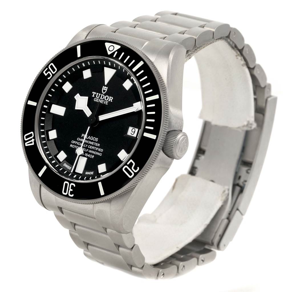 The image shows the Tudor Pelagos 25600TN Men's Titanium Black Dial 25600TN Men's Titanium Black Dial watch at a three-quarter angle, highlighting its face, bezel, and metal bracelet.