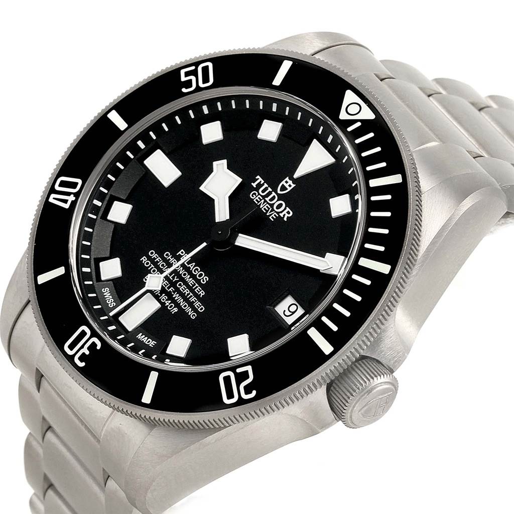 The image showcases a Tudor Pelagos 25600TN Men's Titanium Black Dial 25600TN Men's Titanium Black Dial watch angled from the front-left, highlighting the dial, bezel, crown, and bracelet.