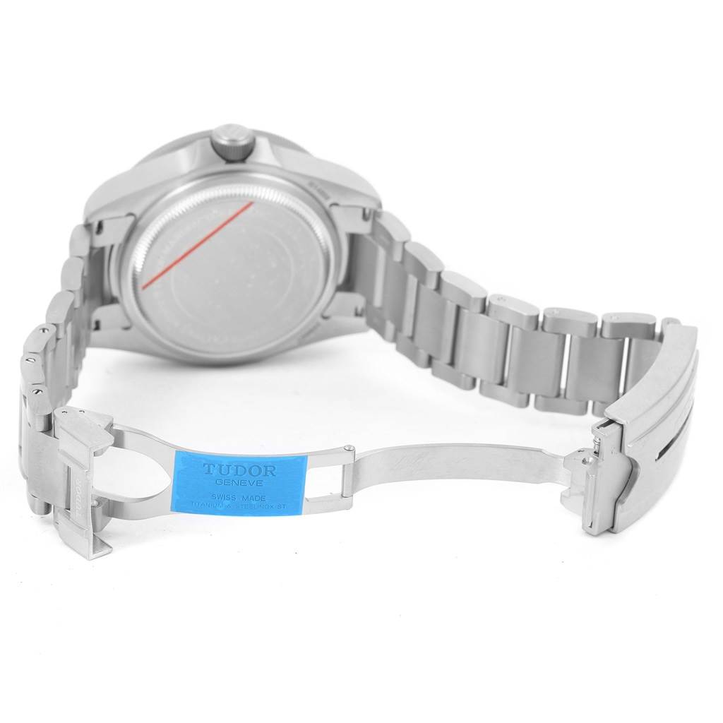 The image shows the backside and open clasp of a Tudor Pelagos 25600TN Men's Titanium Black Dial 25600TN Men's Titanium Black Dial watch with the bracelet displayed.