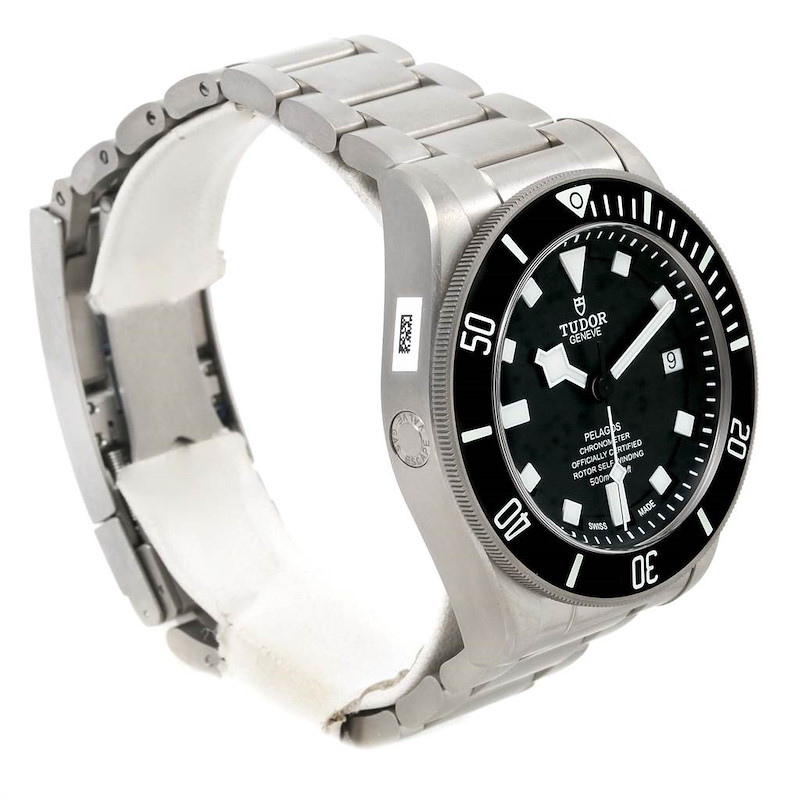 The image shows a side angle of a Tudor Pelagos watch, highlighting its bezel, dial, and bracelet.