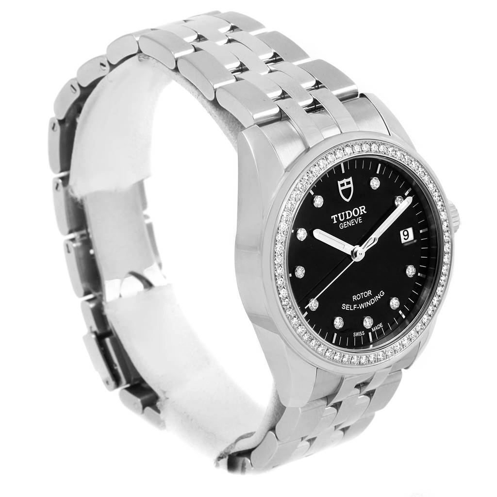 The image shows a Tudor Glamour 55020 Stainless Steel Black Dial 55020 Stainless Steel Black Dial model watch at a three-quarter angle, highlighting its face, bezel, and metal bracelet.