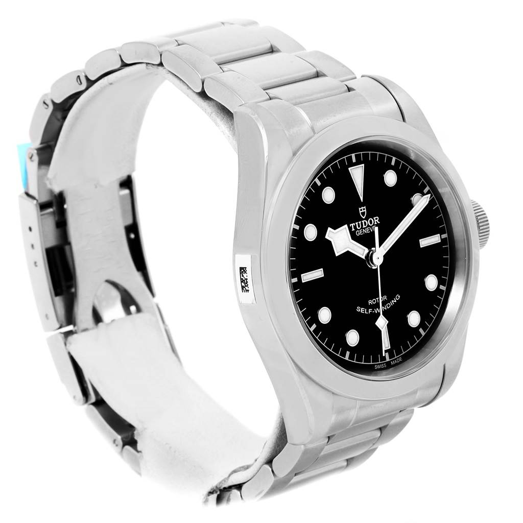 The image shows a side and partial front view of the Tudor Heritage Black Bay 79540 Men
s Stainless Steel Black Dial 79540 Men
s Stainless Steel Black Dial watch, including its black dial and metal bracelet.