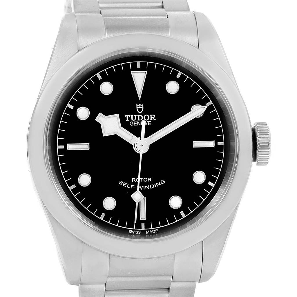 The image shows the front view of a Tudor Heritage Black Bay 79540 Men
s Stainless Steel Black Dial 79540 Men
s Stainless Steel Black Dial model watch, including its dial and part of its bracelet.
