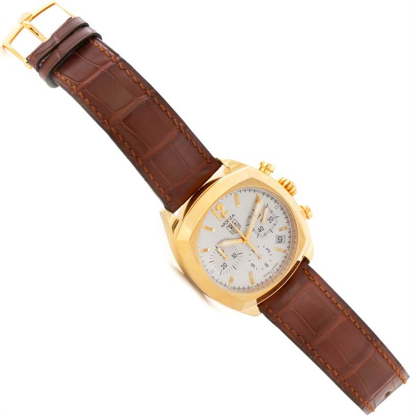 The image shows a Tag Heuer Monza CR514A.FC8145 Men's Yellow Gold Silver Dial CR514A.FC8145 Men's Yellow Gold Silver Dial watch at a slight angle, capturing its gold case, white dial, and brown leather strap.