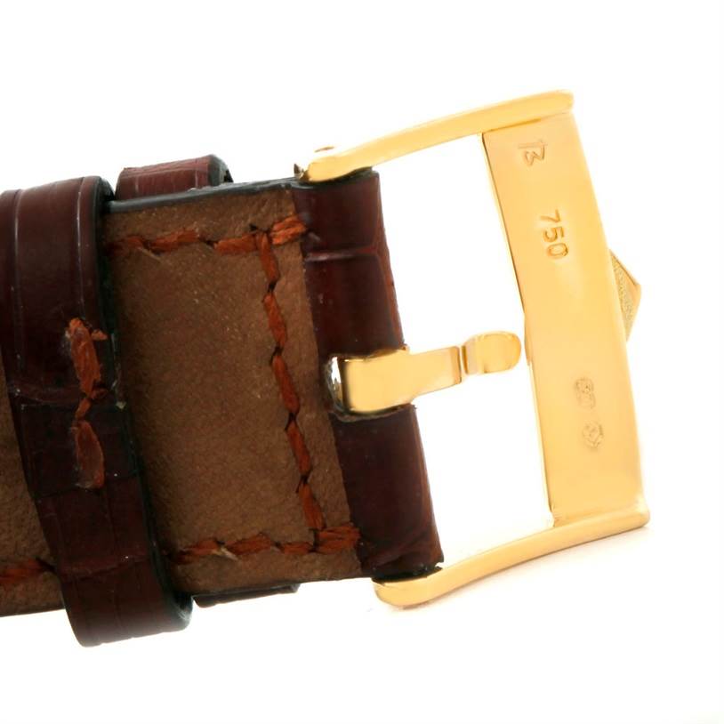 The image shows a close-up of the leather strap and gold buckle of a Tag Heuer Monza CR514A.FC8145 Men's Yellow Gold Silver Dial CR514A.FC8145 Men's Yellow Gold Silver Dial watch.