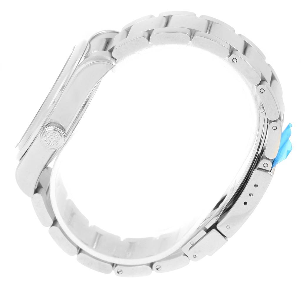 This side view of the Tudor Heritage Black Bay 79500 Men's Stainless Steel Black Dial 79500 Men's Stainless Steel Black Dial model showcases its stainless steel bracelet and case with visible lugs and crown.