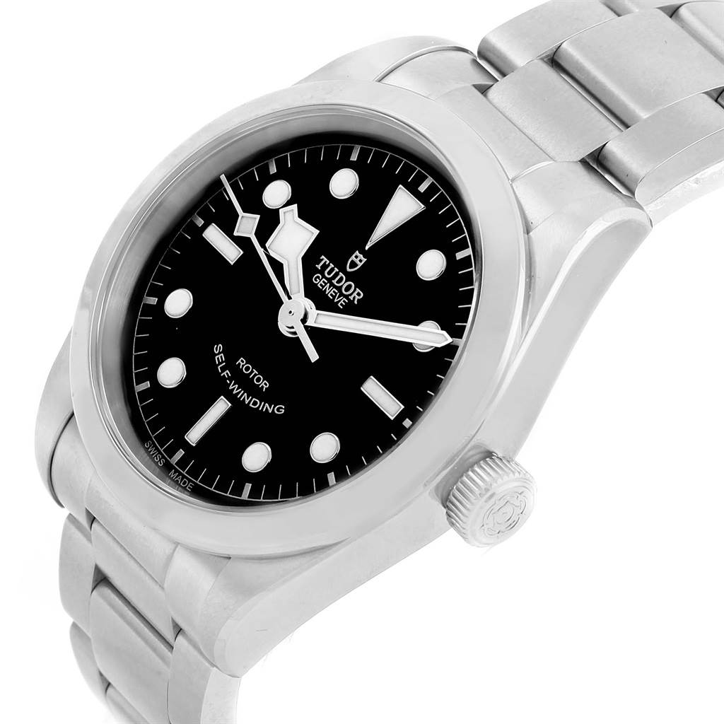 The image shows a close-up side angle of a Tudor Heritage Black Bay 79500 Men's Stainless Steel Black Dial 79500 Men's Stainless Steel Black Dial watch, highlighting the dial, bezel, and bracelet.