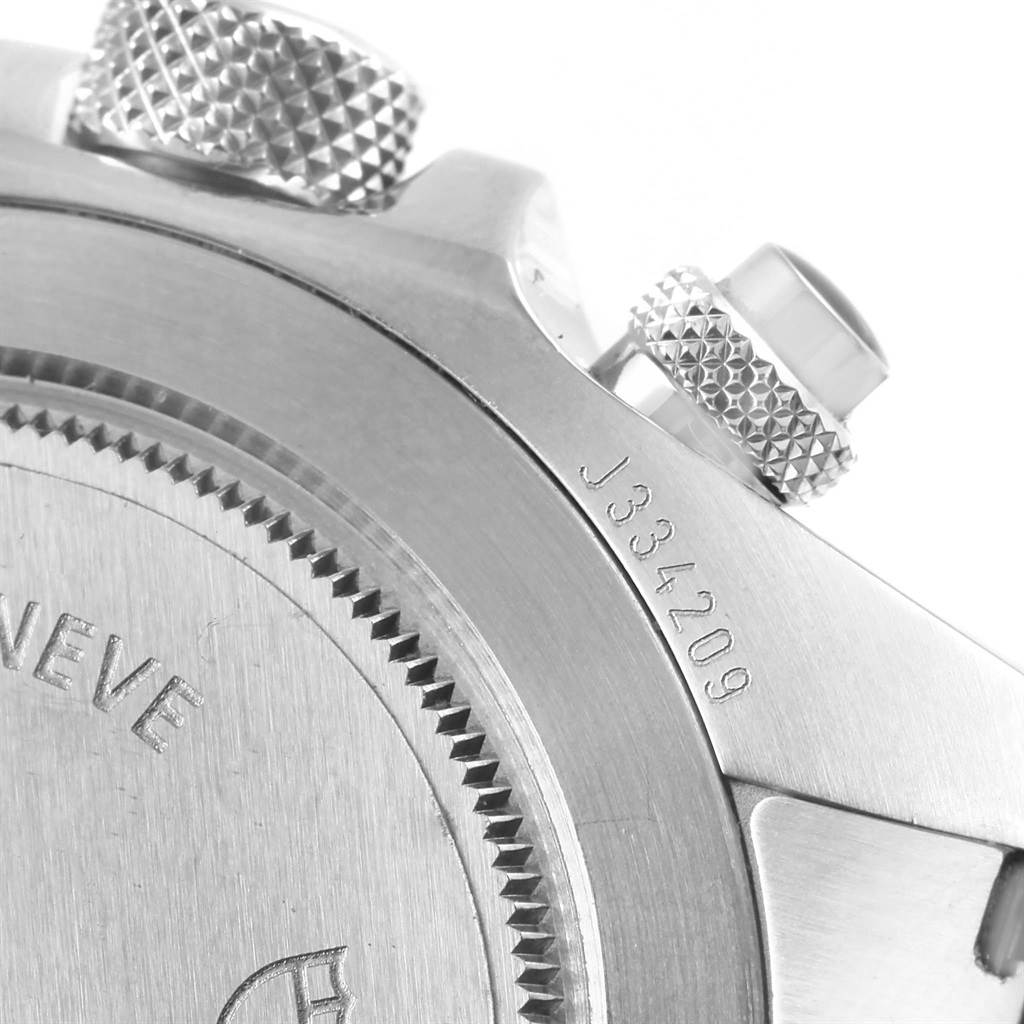 The image shows a close-up of the back case and knurled pushers of a Tudor Heritage Chrono 70330N Men's Stainless Steel Grey Dial 70330N Men's Stainless Steel Grey Dial watch.