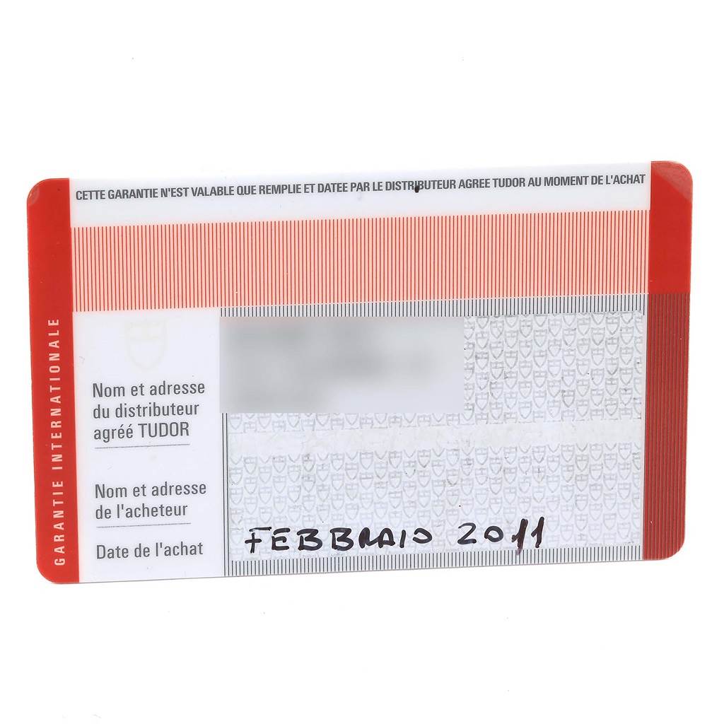 The image shows an international warranty card for the Tudor Heritage Chrono 70330N Men's Stainless Steel Grey Dial 70330N Men's Stainless Steel Grey Dial watch, indicating the purchase date.