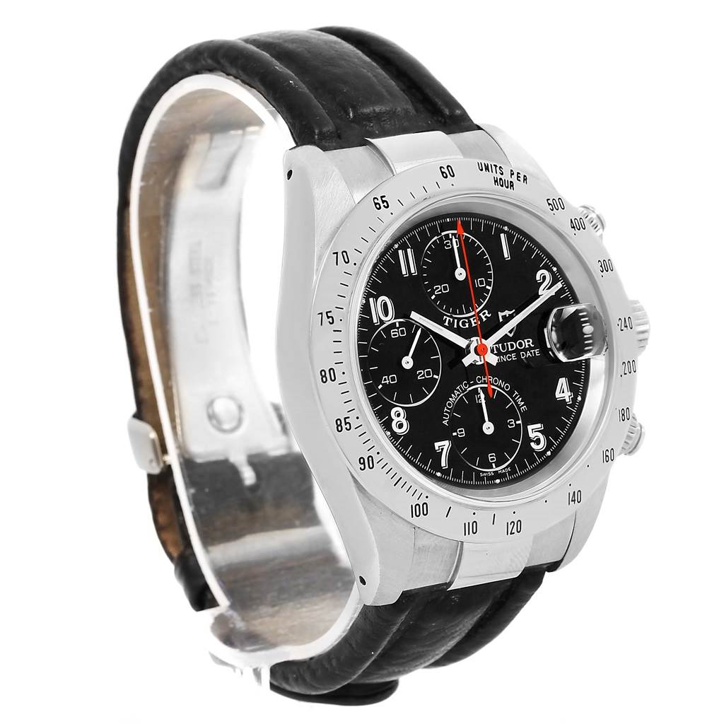 This is a side-angle view of the Tudor Tiger 79280 Men's Stainless Steel Black Dial 79280 Men's Stainless Steel Black Dial model watch, showing its black dial, bezel, and leather strap.