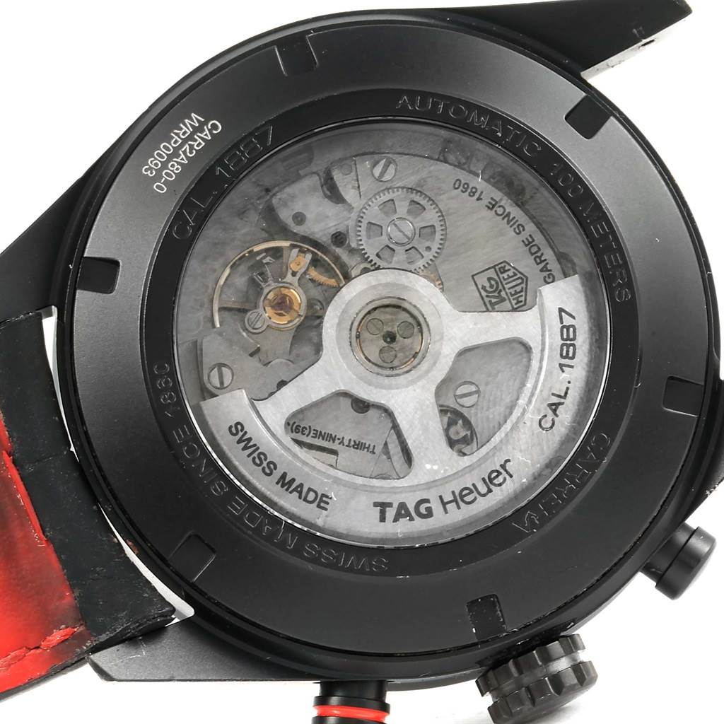 The image shows the back view of a Tag Heuer Carrera CAR2A80-FC6237 Men's Titanium Black Dial CAR2A80-FC6237 Men's Titanium Black Dial watch, highlighting its internal mechanics and "CAL. 1887" engraving.