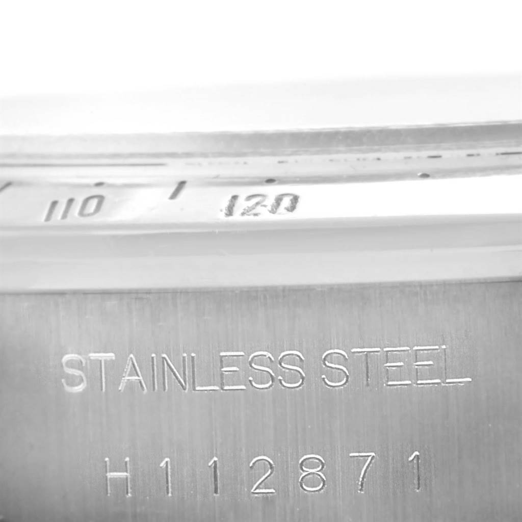 The image shows a close-up of the serial number and "STAINLESS STEEL" engraving on the case of a Tudor Tiger 79280 Men's Stainless Steel Blue Dial 79280 Men's Stainless Steel Blue Dial model watch.