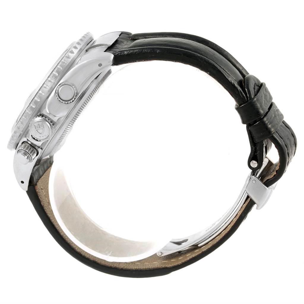 The image shows a side view of a Tudor Tiger 79260 Men's Stainless Steel Black Dial 79260 Men's Stainless Steel Black Dial model watch, highlighting its case, bezel, crown, and leather strap.