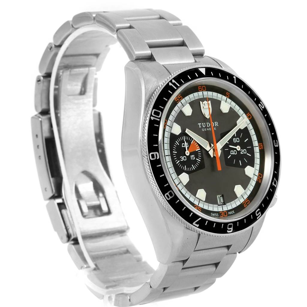 The image shows a Tudor Heritage Chrono 70330N Men's Stainless Steel Grey Dial 70330N Men's Stainless Steel Grey Dial watch at an angle highlighting its face, bezel, and partially open metal bracelet.