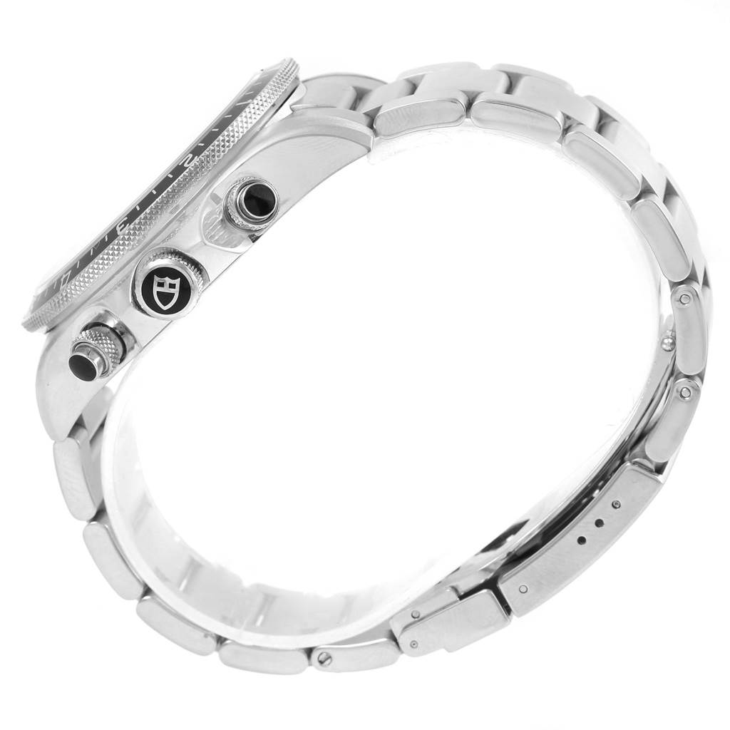 The image shows a side view of the Tudor Heritage Chrono 70330N Men's Stainless Steel Grey Dial 70330N Men's Stainless Steel Grey Dial watch, highlighting the crown, pushers, and part of the bracelet.