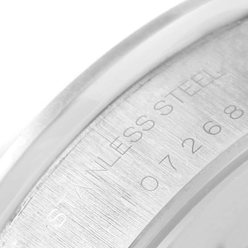 The image shows a close-up angle of the case back edge of the Tudor Tiger 79260 Men's Stainless Steel Silver Dial 79260 Men's Stainless Steel Silver Dial watch, displaying the "STAINLESS STEEL" engraving and partial serial number.