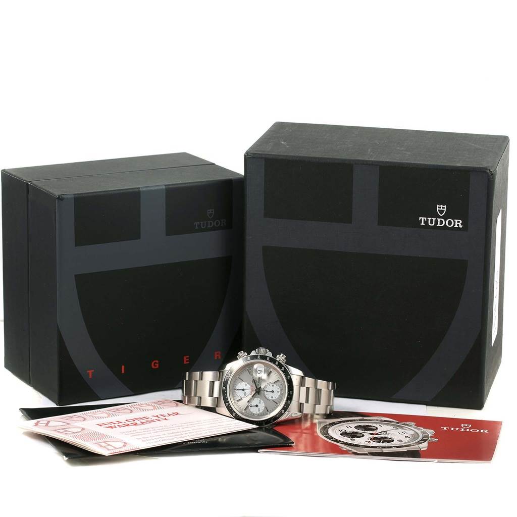 The image shows a Tudor Tiger 79260 Men's Stainless Steel Silver Dial 79260 Men's Stainless Steel Silver Dial watch along with its boxes, manuals, and warranty cards from a frontal angle.
