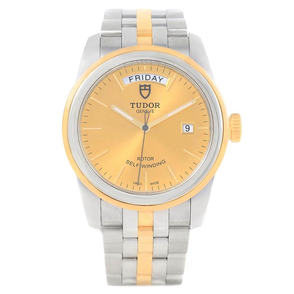 The image shows a frontal view of a Tudor Glamour 56003 Men's Steel and Gold (two tone) Champagne Dial 56003 Men's Steel and Gold (two tone) Champagne Dial model watch with a gold dial, dual-tone bezel, and stainless steel and gold bracelet.