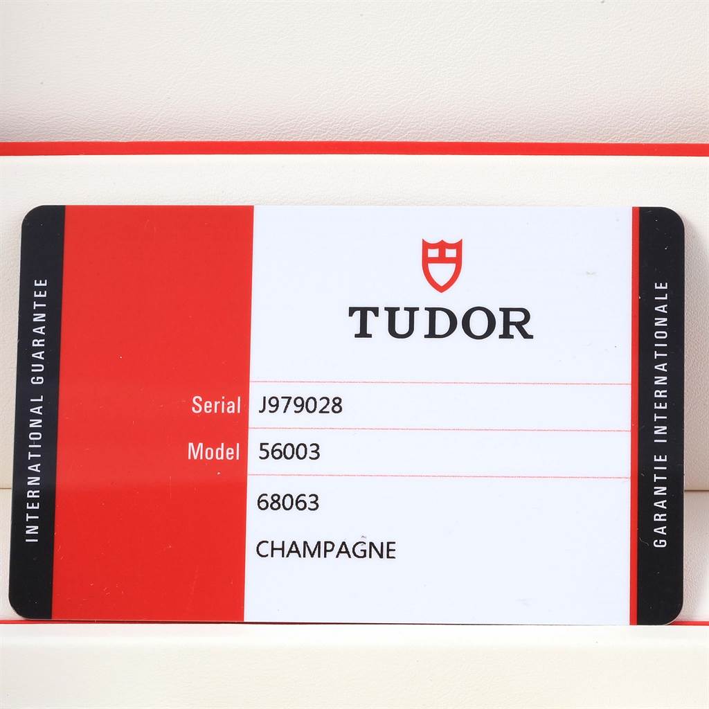 The image shows an international guarantee card for the Tudor Glamour 56003 Men's Steel and Gold (two tone) Champagne Dial 56003 Men's Steel and Gold (two tone) Champagne Dial model, featuring serial and model numbers.