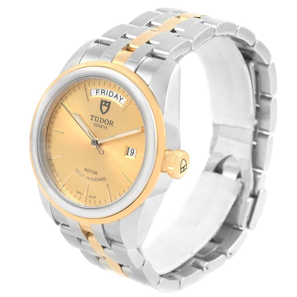 This is a side-angle view of the Tudor Glamour 56003 Men's Steel and Gold (two tone) Champagne Dial 56003 Men's Steel and Gold (two tone) Champagne Dial model watch showing the face, crown, and part of the bracelet.