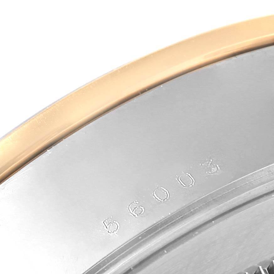 This image shows a close-up view of the case back edge of a Tudor Glamour 56003 Men's Steel and Gold (two tone) Champagne Dial 56003 Men's Steel and Gold (two tone) Champagne Dial model watch, displaying the model number.