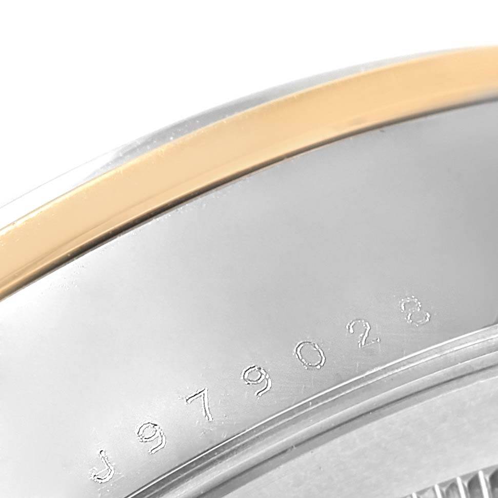 The image shows a close-up of the bezel and casing with the serial number on the Tudor Glamour 56003 Men's Steel and Gold (two tone) Champagne Dial 56003 Men's Steel and Gold (two tone) Champagne Dial model watch.