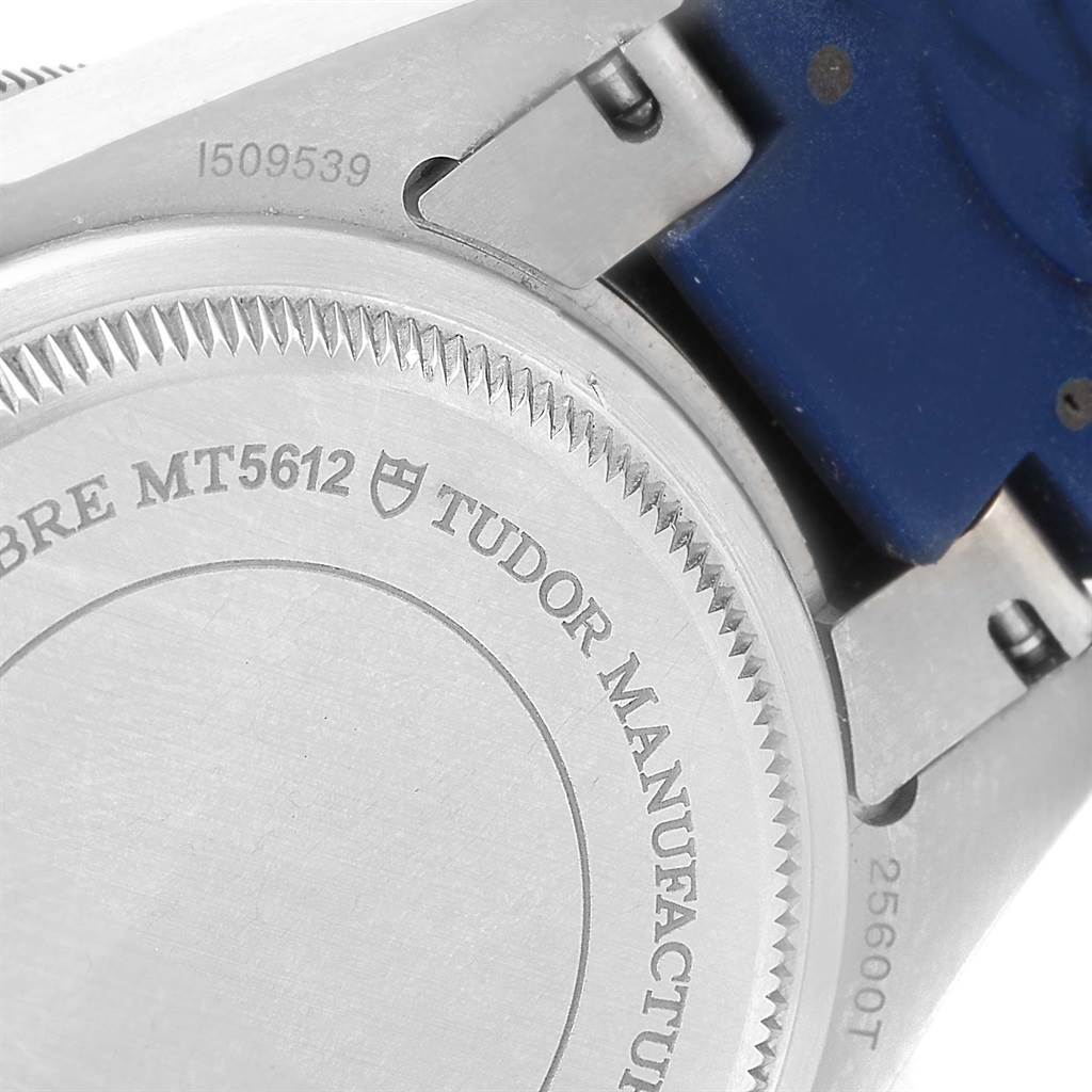 The image shows the case back and part of the strap of a Tudor Pelagos 25600 Men's Titanium Blue Dial 25600 Men's Titanium Blue Dial watch.