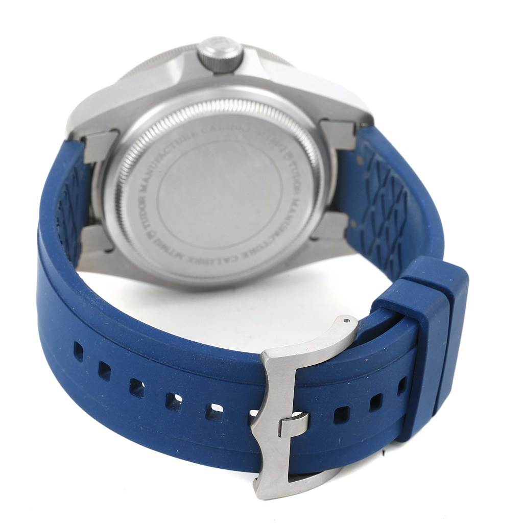 The image shows the back case and blue rubber strap of a Tudor Pelagos 25600 Men's Titanium Blue Dial 25600 Men's Titanium Blue Dial watch.
