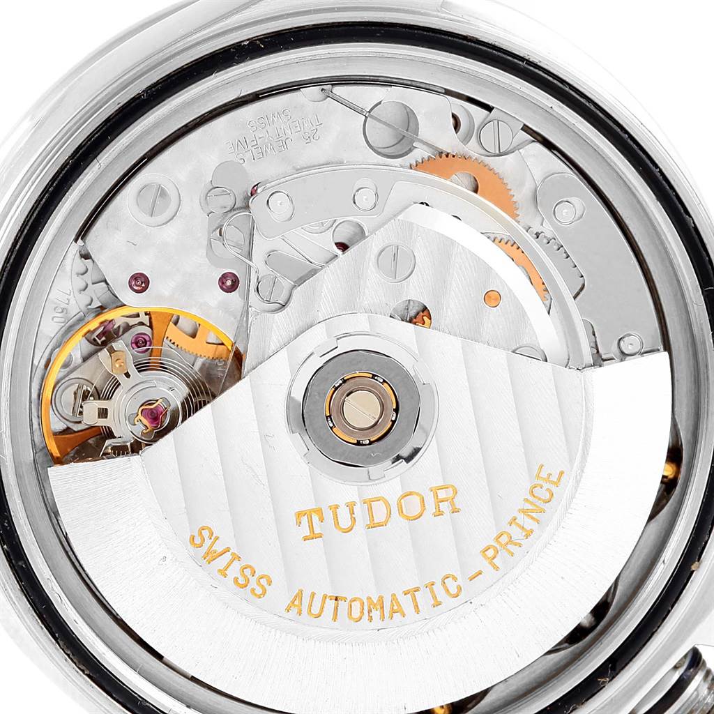 The image shows the internal mechanics of the Tudor Tiger 79280 Men's Stainless Steel Burgundy Dial 79280 Men's Stainless Steel Burgundy Dial model watch, highlighting its automatic movement from an angled rear view.