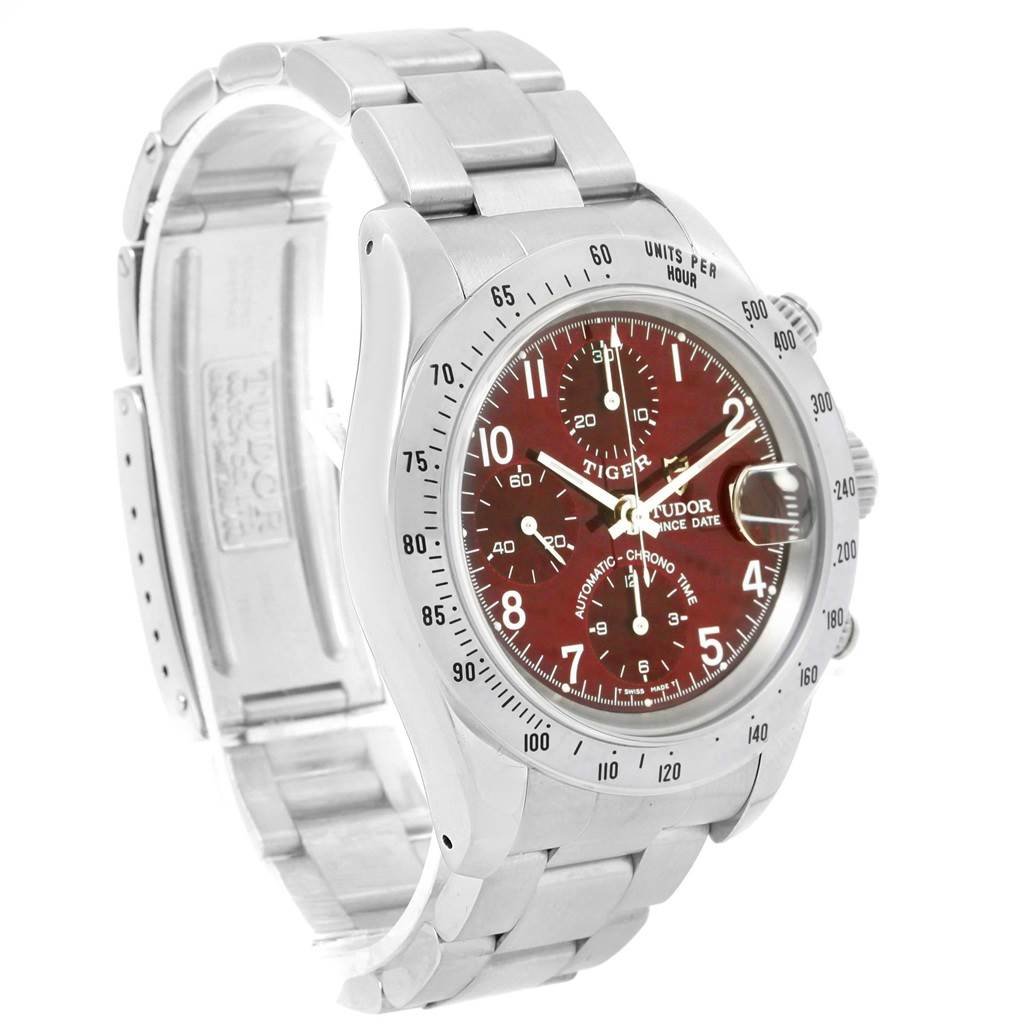 The image shows a Tudor Tiger 79280 Men's Stainless Steel Burgundy Dial 79280 Men's Stainless Steel Burgundy Dial model watch at a three-quarter angle, highlighting its face, bezel, crown, and stainless steel bracelet.