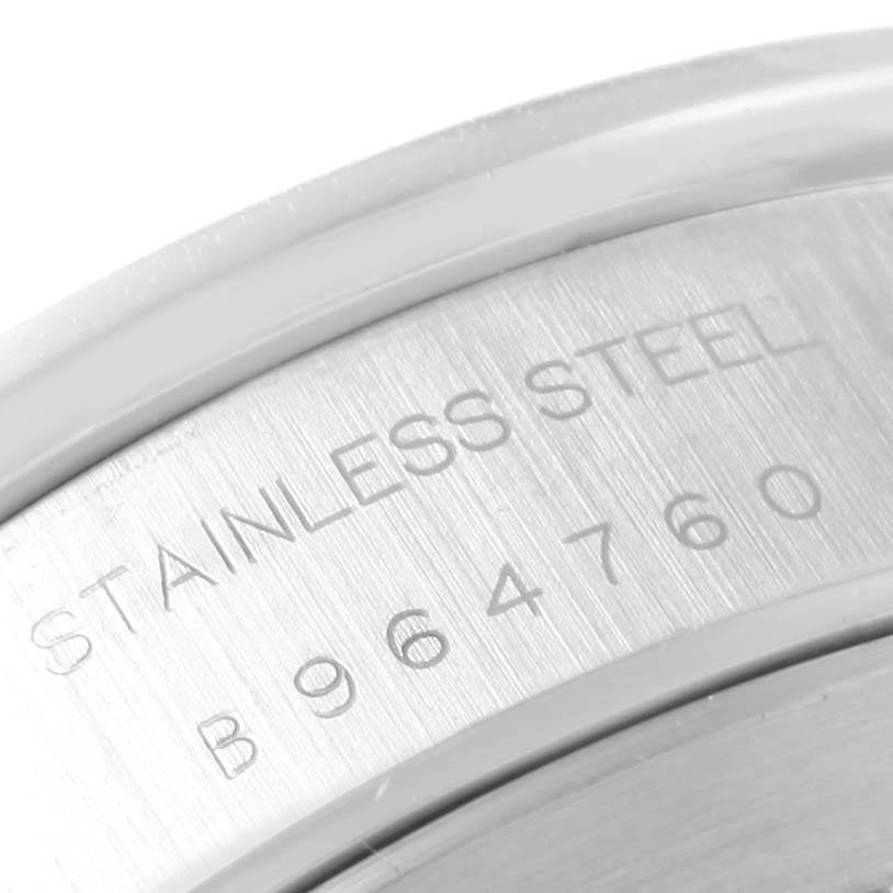 The image shows a close-up of the stainless steel back case of the Tudor Tiger 79280 Men's Stainless Steel Burgundy Dial 79280 Men's Stainless Steel Burgundy Dial model watch, with part of the serial number visible.