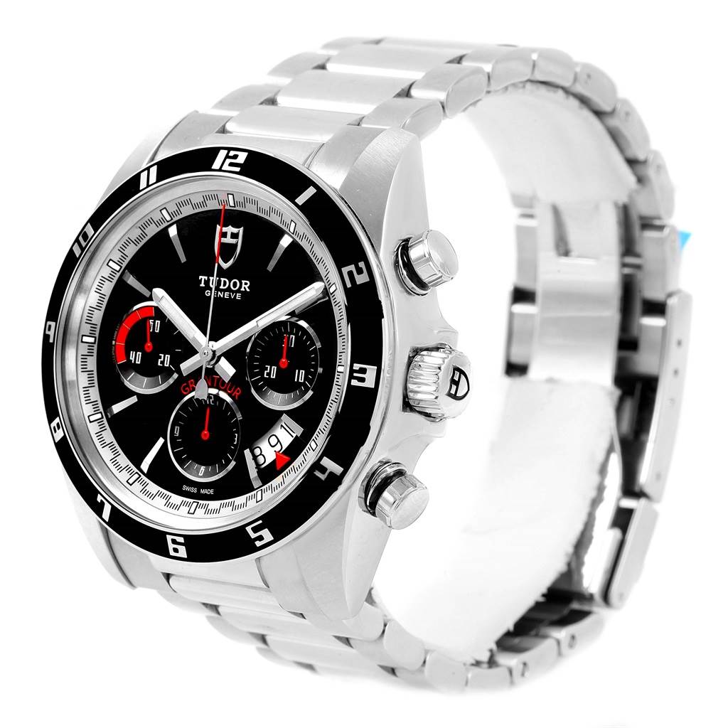 The image shows a Tudor Grantour 20530N-95730 Men's Stainless Steel Black Dial 20530N-95730 Men's Stainless Steel Black Dial watch from an angled perspective, highlighting its face, side buttons, and metal band.