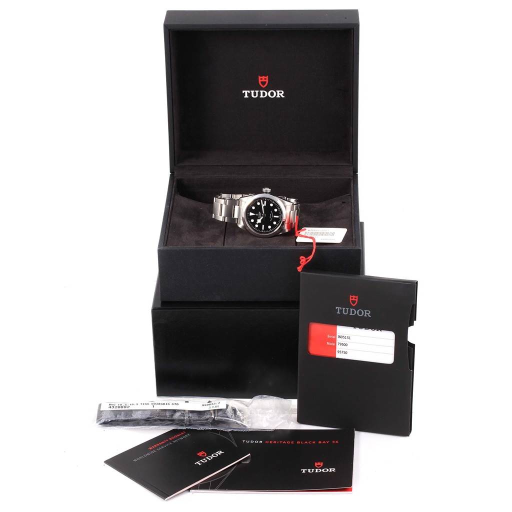The image shows a Tudor Heritage Black Bay 79500 Men's Stainless Steel Black Dial 79500 Men's Stainless Steel Black Dial watch, box, warranty card, booklets, and additional accessories from a front angle.