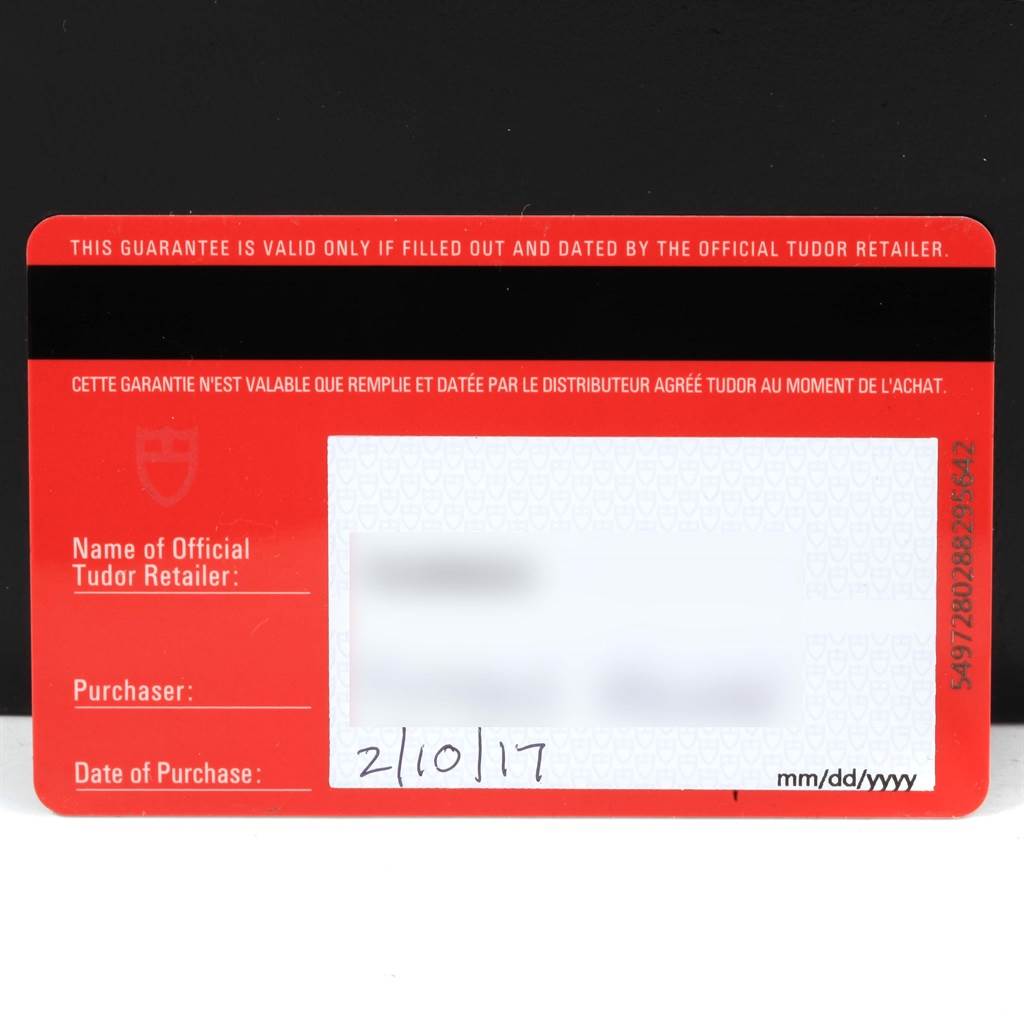 This image shows the warranty card for the Tudor Heritage Black Bay 79500 Men's Stainless Steel Black Dial 79500 Men's Stainless Steel Black Dial watch with details blurred out.