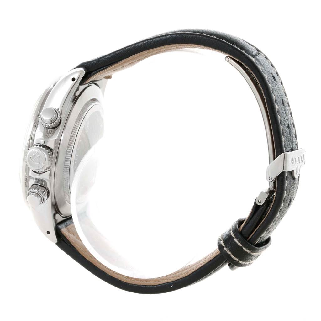 The Tudor Tiger 79273 Men's Stainless Steel White Dial 79273 Men's Stainless Steel White Dial model watch is shown from the side, highlighting its crown, pushers, and leather strap.