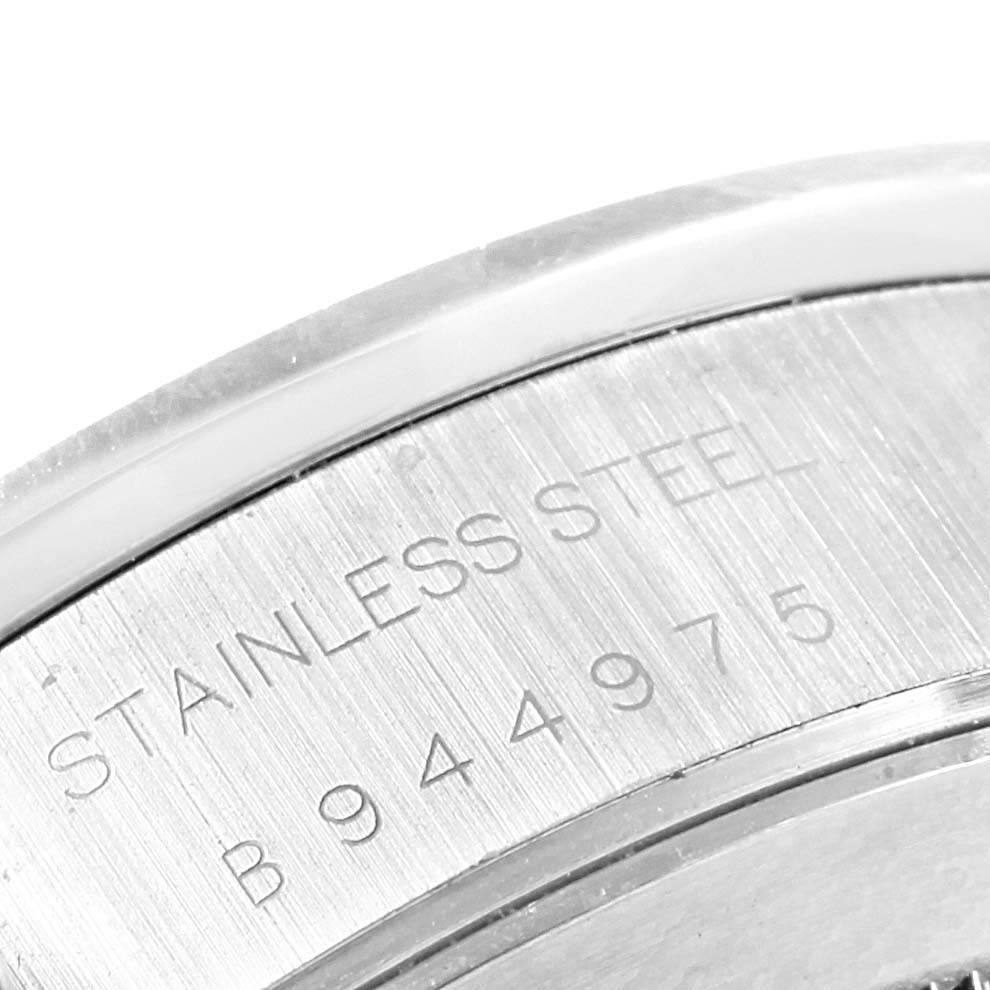 This close-up image displays the brushed stainless steel back case of the Tudor Tiger 79273 Men's Stainless Steel White Dial 79273 Men's Stainless Steel White Dial model watch, revealing its serial number.