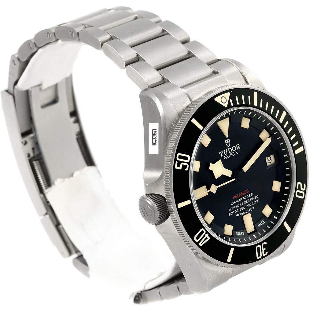 The Tudor Pelagos 25610TNL Men's Titanium Black Dial 25610TNL Men's Titanium Black Dial watch is shown at an angle highlighting the dial, bezel, crown, and metal bracelet.