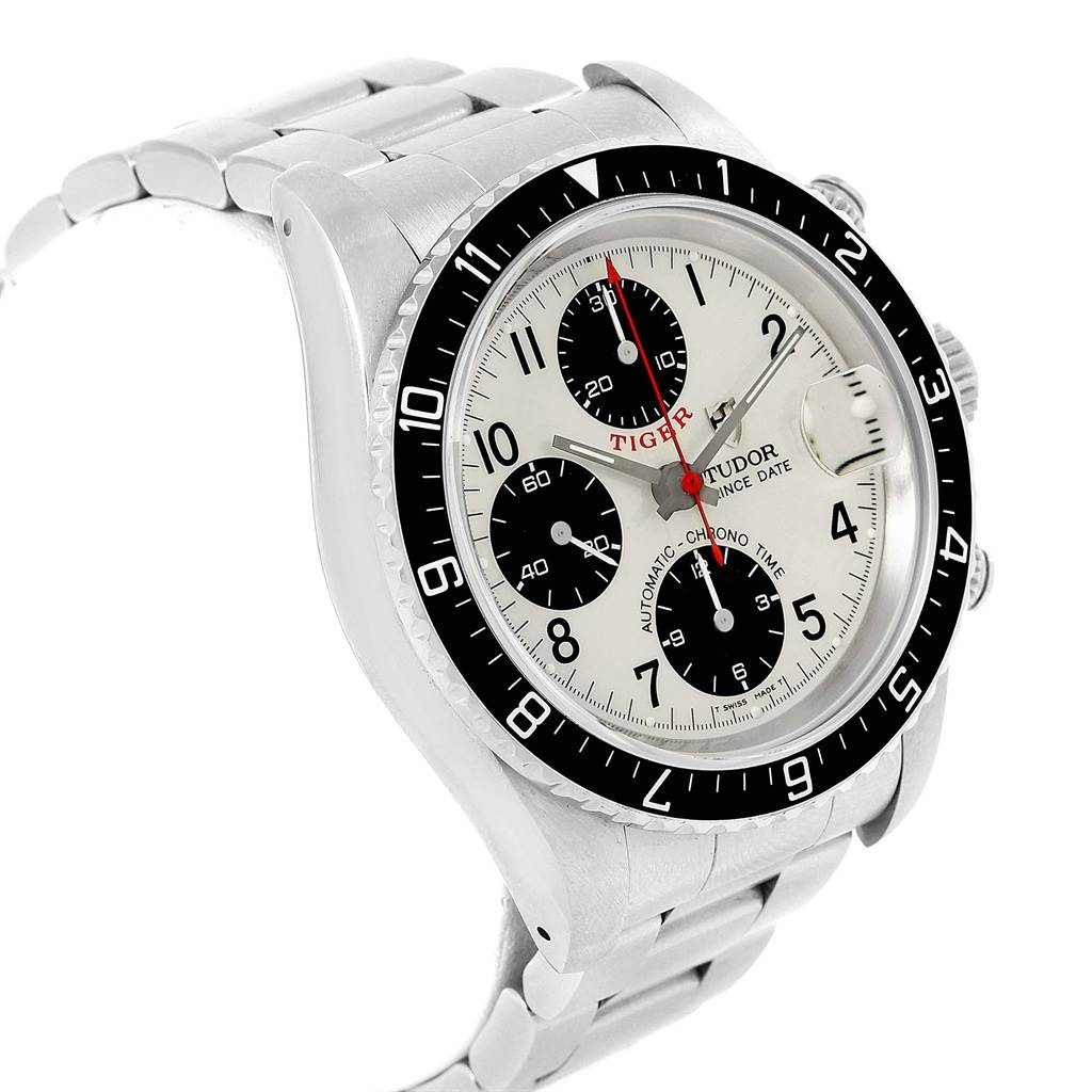 The image shows a Tudor Tiger 79270 Men's Stainless Steel White Dial 79270 Men's Stainless Steel White Dial watch at an angle showcasing the dial, bezel, and part of the bracelet.