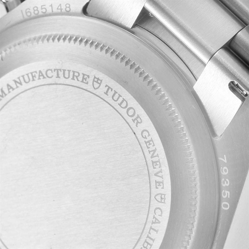 The image shows the case back and part of the bracelet of the Tudor Heritage Black Bay 79350 Men's Stainless Steel Black Dial 79350 Men's Stainless Steel Black Dial watch.