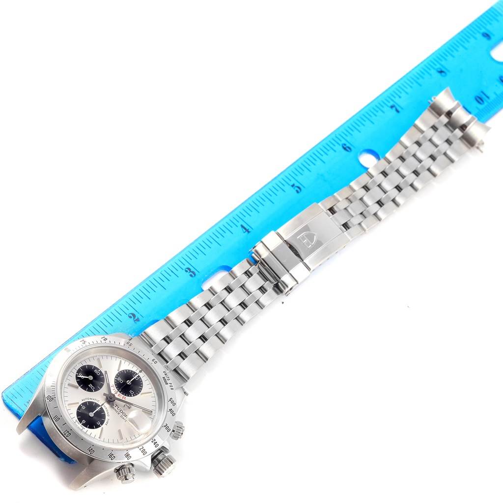 The image shows a Tudor Tiger 79280 Men's Stainless Steel Silver Dial 79280 Men's Stainless Steel Silver Dial watch with a stainless steel bracelet, viewed from a top angle next to a ruler for scale.