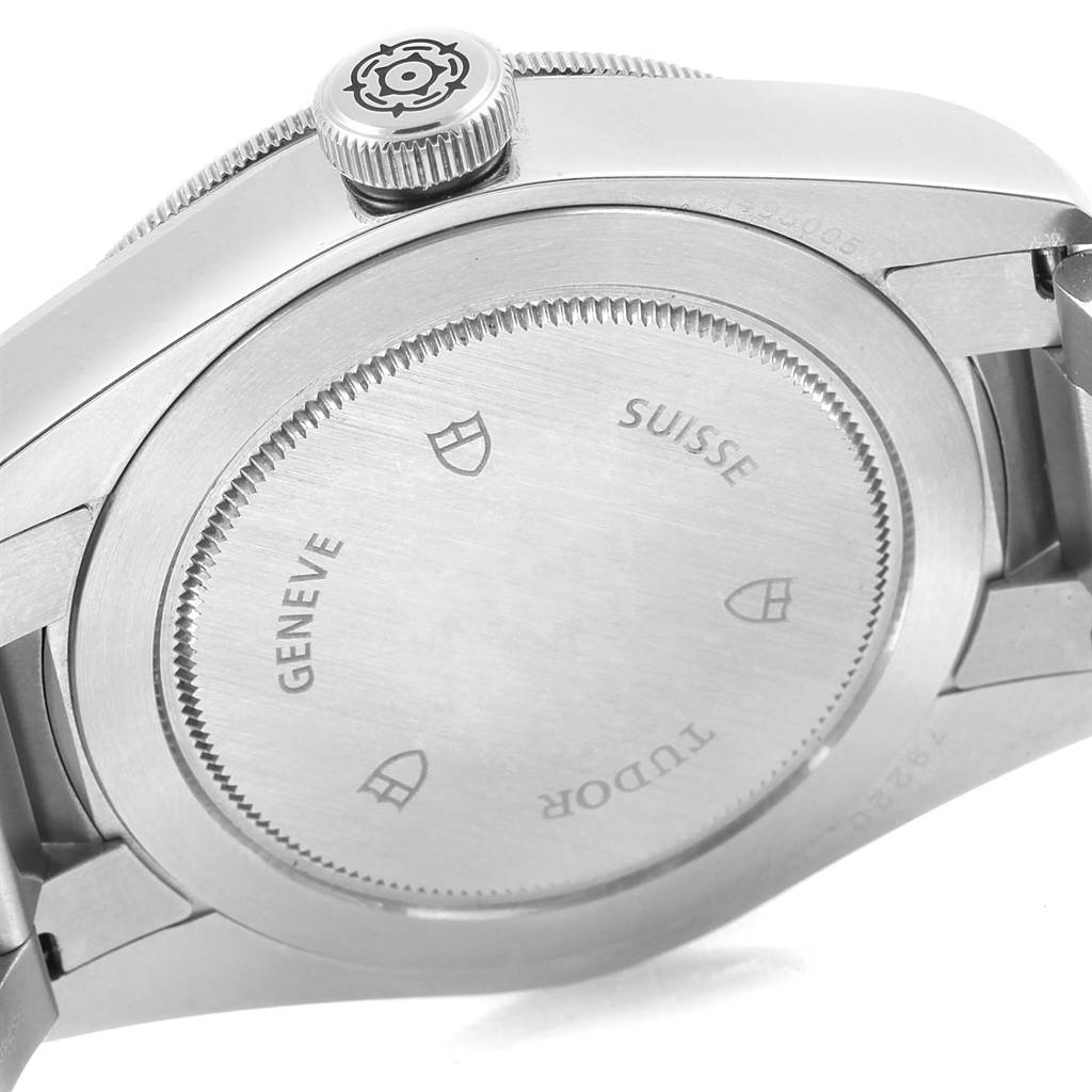 The image shows the case back and crown of the Tudor Heritage Black Bay 79220N Men's Stainless Steel Black Dial 79220N Men's Stainless Steel Black Dial watch, viewed from an angled side perspective.