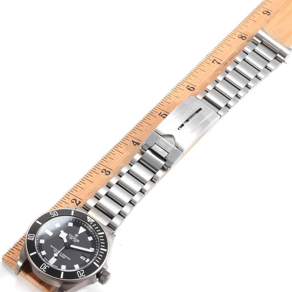 The image shows a Tudor Pelagos 25500TN Men's Titanium Black Dial 25500TN Men's Titanium Black Dial watch laid flat alongside a ruler, displaying the full bracelet and face.