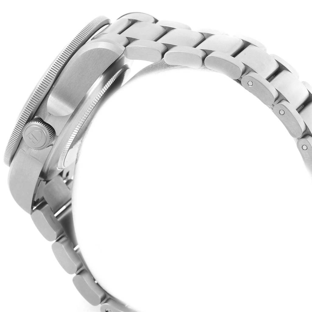 This image shows a side view of a Tudor Pelagos 25500TN Men's Titanium Black Dial 25500TN Men's Titanium Black Dial watch focusing on the case, bezel, crown, and metal bracelet.